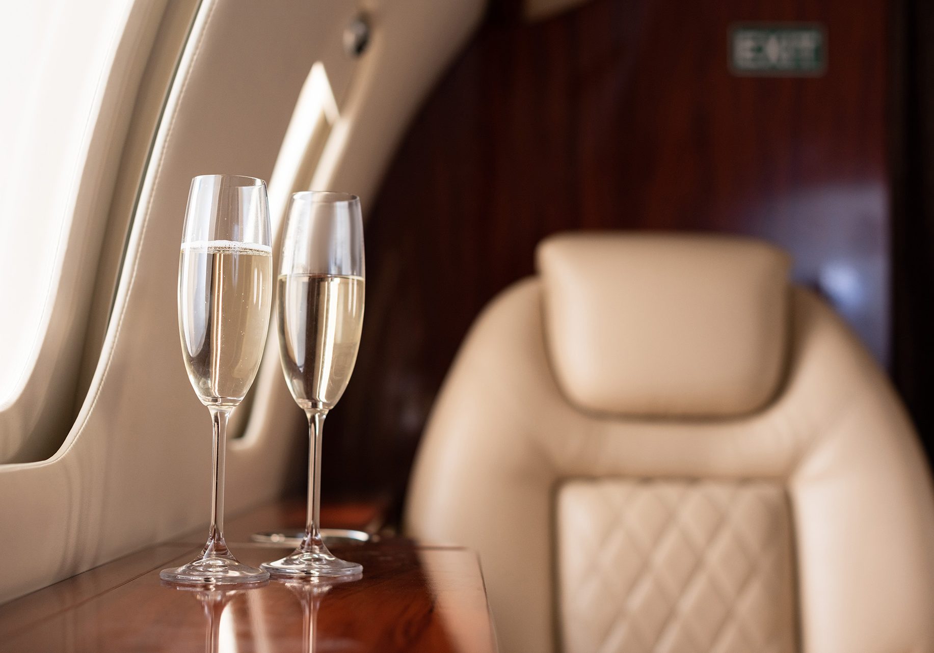 two-champagne-flutes-in-a-private-jet-2026-09-22-07-32-26-utc
